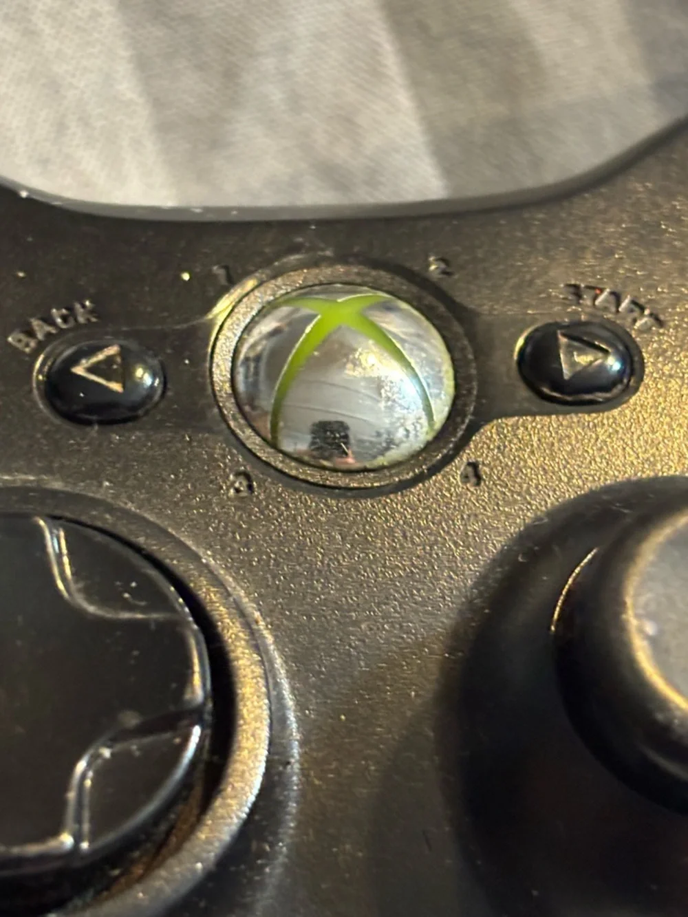 Microsoft Black Xbox 360 Wireless Controller with Colored Face Buttons.